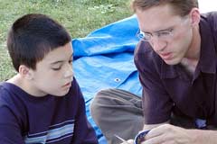 OAC evangelist sharing the gospel with a child